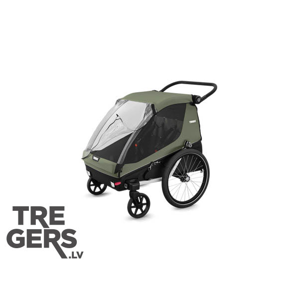 Thule Courier 2 Vintage Green pastaigu ratiņu režīmā ar grozāmu priekšējo riteni
